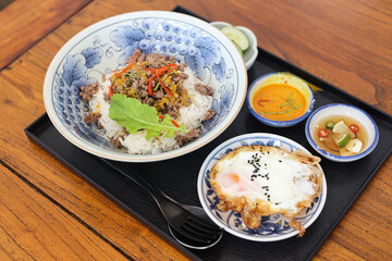 Rice topped with stir fried pork and basil.