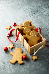 Traditional festive gingerbread men in a wooden box