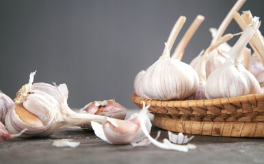 Garlic bulbs on the stone background.