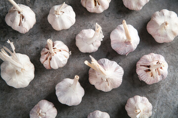 Garlic bulbs on the stone background.