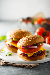 Traditional homemade cheeseburgers on a plate