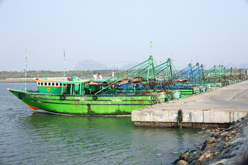 Fototapeta na wymiar Fishing boats in the harbor , getting ready for fishing.