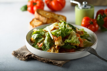 Traditional homemade Caesar salad with salmon