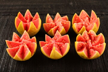 Organic sweet ripe red ,pink  guava fruits slices.