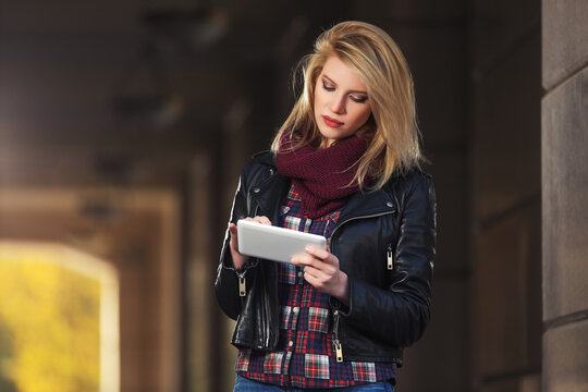 Young fashion woman using digital tablet computer