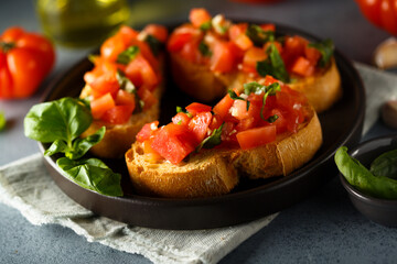 Traditional homemade bruschetta with tomato and basil