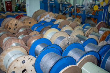 industrial production of optical fiber cable in a factory. Cables for telecommunications,...
