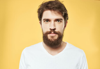 Obraz premium emotional man in a white t-shirt expressive look discontent close-up