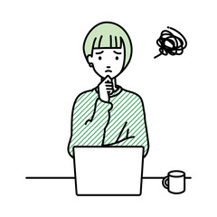 デスクで座ってPCを開いて困っているリモートワークの女性