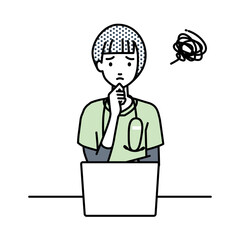 デスクで座ってPCを開いて困っている看護師の女性