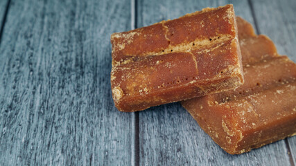 panela, from sugar cane, for different preparations on a gray background, made in Colombia.