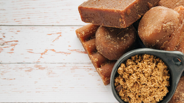 panela, from sugar cane, for different preparations on a white wooden base, made in Colombia.