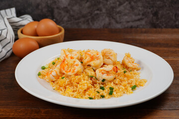 Shrimp fried rice and homemade food egg on a white plate