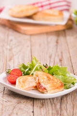 Puff pastry filled with tomato and mozzarella cheese.