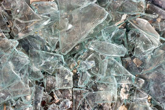 Broken glass. Pieces of broken glass. Sharp glass.