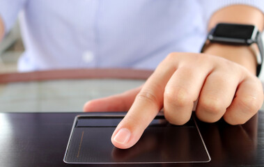 Closeup hand using computer laptop. Using online connect technology for business, education and communication. Boundless working concept