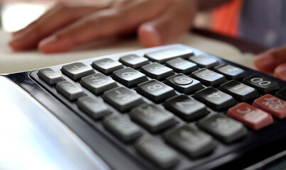 calculator to convey the concepts of tax season and monthly expenses