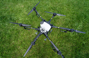 Professional agriculture drone on the green field