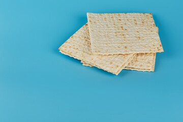 Traditional kosher matzah for Easter on a blue background