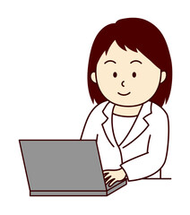 パソコンで作業する笑顔の若い女性医師