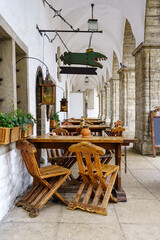 Wooden medieval tables and chairs in the city of Tallinn, Estonia.
