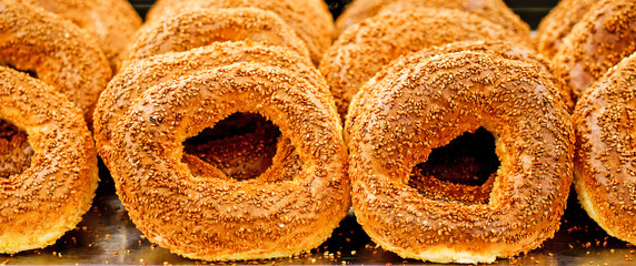 Closeup of traditional turkish bagel simit on tray. Suitable for header or banner.