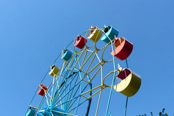 High Ferris wheel against the blue sky