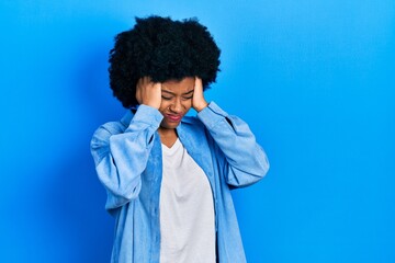 Fototapeta na wymiar Young african american woman wearing casual clothes suffering from headache desperate and stressed because pain and migraine. hands on head.