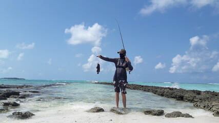 Sea view from tropical beach with blue sky.