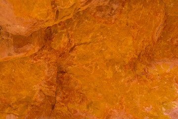 Texture of the orange stone with the crack