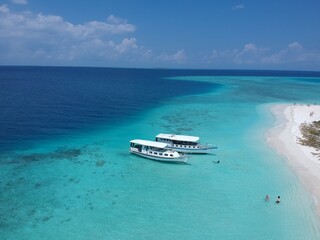 Sea view from tropical beach with blue sky.