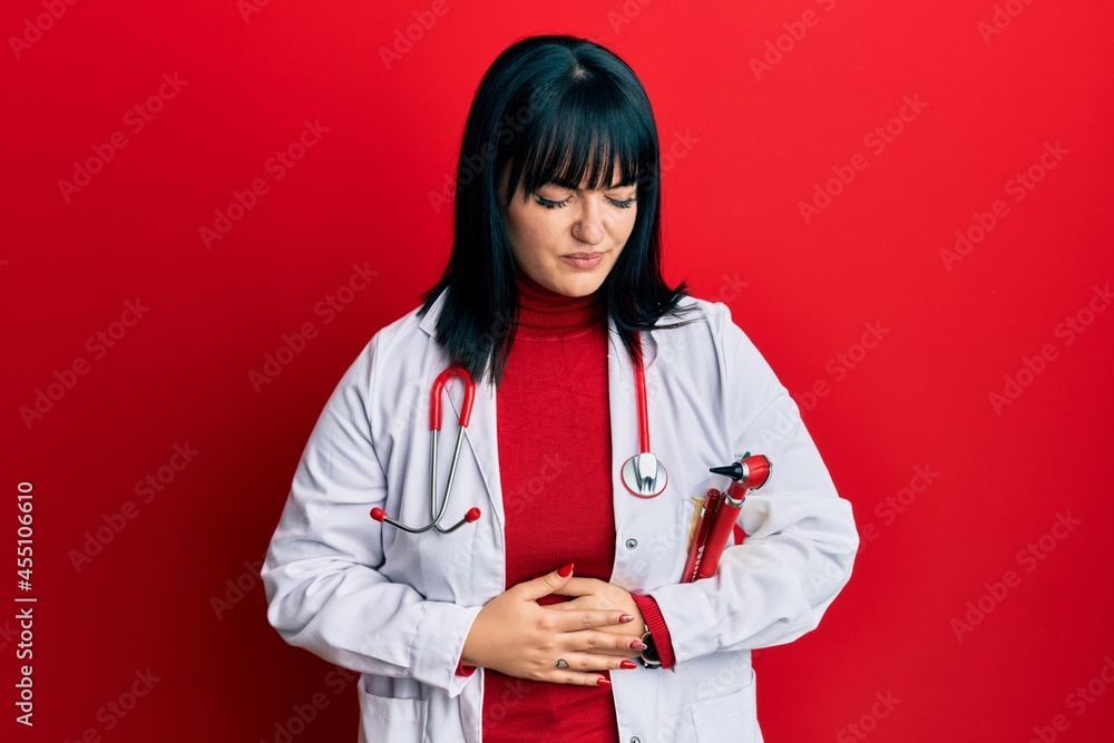 Poster Young hispanic woman wearing doctor uniform and stethoscope with hand on stomach because indigestion, painful illness feeling unwell. ache concept.