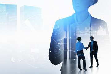 Businessman wearing formal suit is shaking hands with businesswoman