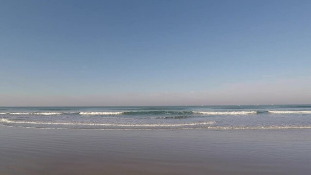 Morning waves of the Indian Ocean on Mobor beach in Goa India