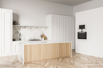 White kitchen with marble backsplash and wood materials. Corner view.