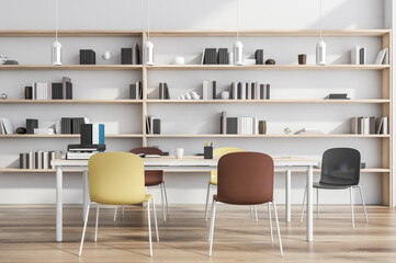 Modern white collaboartion space with stylish chairs and wood materials