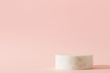 White cosmetic background with white stone empty space