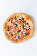 Homemade pizza isolated on white background. View from above.