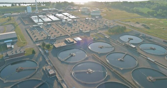 Aerial top view recirculation sedimentation tank, water treatment plant near pond the of solar power station float