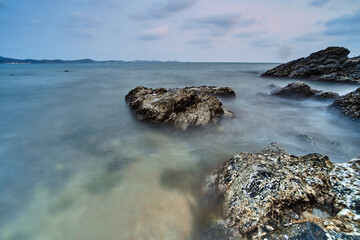 sunset at rocky shore seascape scene