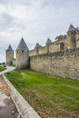 Fototapeta na wymiar Medieval citadel at Carcassonne - huge and completely over-the-top, encompassing no less than 53 towers, enormous concentric walls, surrounded by a moat. Aude department, region of Occitanie, France.