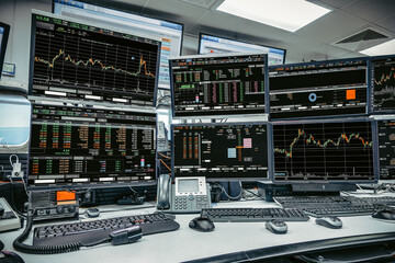 group of stock data monitor analyzing data stock market in monitoring room on the data presented in...