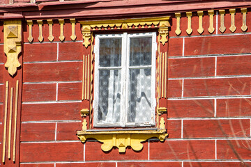 Decorative wall of a house with a window, folk architecture, Czech Republic.