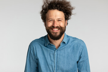 happy unshaved man in denim shirt having fun and laughing