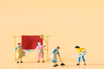 Miniature people Housewife Maid or Worker standing and cleaning dirty room house using as Hospitality Hotel cleaning service business or health care healthy and wellness life style safety concept