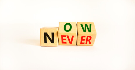 Now or never symbol. Turned wooden cubes and changed the word 'never' to 'now' or vice versa. Beautiful white background, copy space. Business and now or never planning concept.