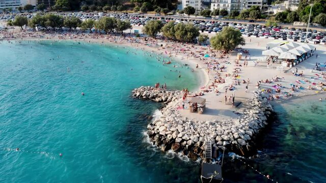 Drone view of the Croatian city of Split in the resort region of Dalmatia. Shot from a drone of a beach in Split. Croatia beach. People sunbathe on the beach view from a drone. Split architecture