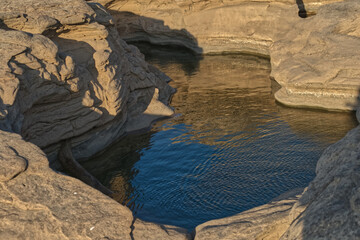 Blue pond from sky reflection in a canyon