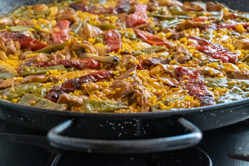 Close-up of a typical Valencian paella, freshly made and ready to eat.