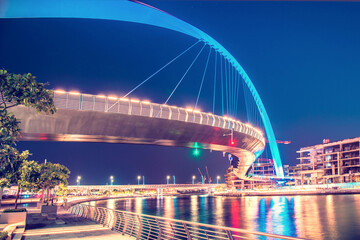 Fototapeta na wymiar Beautiful incredible cityscape with Tolerance bridge near the water canal in Dubai, United Arab Emirates.